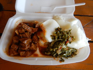 Lunch! Sadza and beef stew with greens. Sadza is ground maize and a lot like thick grits. Very tasty.
