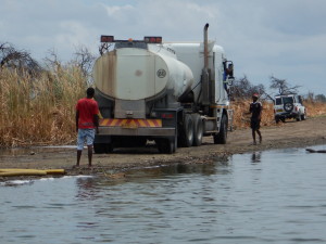 Other uses of lake water. This truck was pumping water for brick making. You need a permit to use natural water, but permits are apparently easy to get and the water is free with the permit.