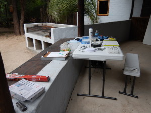 My work station in a pavilion at Shakawe River Lodge - we were thankful to stay dry in the rain.