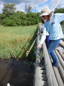 Moss and I collecting a water sample from the Khwai bridge.