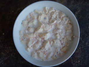 Milk mixed with dry baobab pulp, in the process of making baobab yogurt.