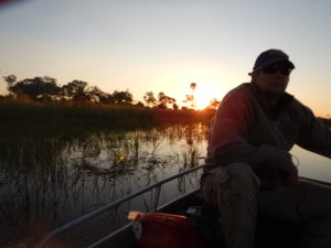 Brandon and a sunset in the Okavango. 