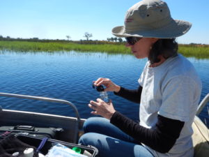 Thea measuring water quality in the Okavango